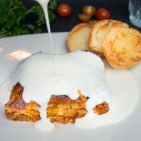 Vegetarian Lasagne with bechamel sauce and garlic bread at Makao in Salento