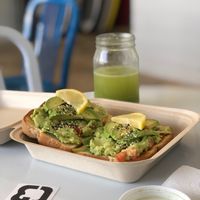 Green machine toast and avocado toast! So good!  at Grati Cafe in Key Largo