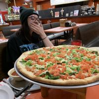 large violife pizza with broccoli, spinach, and diced tomatoes.  at Brother's Pizza in Hamilton