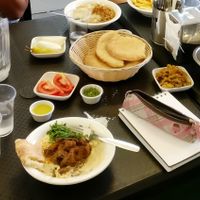 Mushroom Hummus with pitas, pickles & tomatoes at "Hummus Eliahou" at Hummus Eliahou in Afula