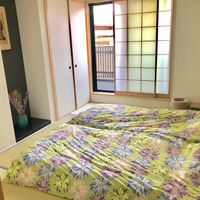 Bedroom (after being used) at Vegan Minshuku Sanbiki Neko in Kyoto
