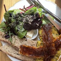Vegan scrambled eggs, vegan bacon, fresh bread and side salad   at püük - fein + herausgeputzt in Hamburg