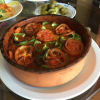Seniya of potatoes, onions and green peppers served in clay pot at Syrian Palace in Aqaba