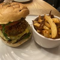 Burger with onion rings   at Fresh Kitchen & Juice Bar in Toronto
