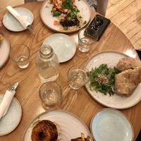 Water on table as standard, tex mex scramble (top), 9 layer burrito (right) bbq burger topped with onion rings (lower) at Fresh Kitchen & Juice Bar in Toronto