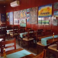 Seating area with art at Elvi's Kitchen in San Pedro