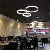 Dining area + kitchen at Restaurant O in Coos Bay