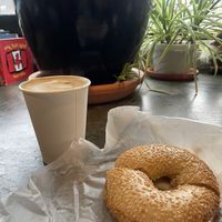 Poppyseed bagel with almond butter and latte with oat milk  at The Cornerstone in Guelph