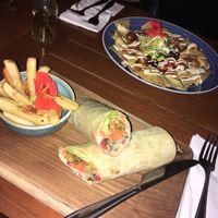 Vegan chicken sandwich (actually a wrap), and Kin Nachos: both delicious! at Kin Cafe in Seminyak