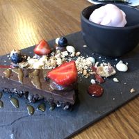 chocolate tarte with crashed orion cookies & orange sorbet - be aware of the decoration: nothing of this was vegan (I asked)!!! Be sure to asked the stuff if you have doubts! at Zeeuwse Streken in Middelburg