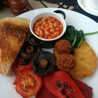 Vegan breakfast (falafel, potato rosti, roast peppers, tomatoes, mushrooms, sourdough toast, beans) at The Cosy Club in Lincoln