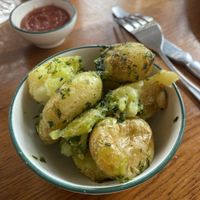 Crushed new potatoes with veg garlic butter   at The Cosy Club in Liverpool