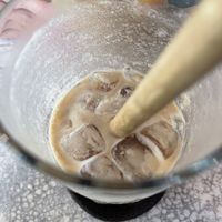 Vietnamese coffee half finished. Why is it lumpy?  at Roots Plant-Based Cafe in Da Nang