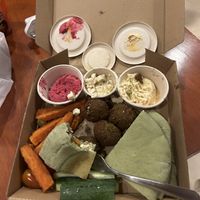 Vegan ‘feta’ cheese in central pot. Hidden under bread are fresh tomatoes and olives too  at Roots Plant-Based Cafe in Da Nang