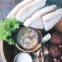 Mediterranean bowl with added pita bread... oh my the falafels.  at Roots Plant-Based Cafe in Da Nang