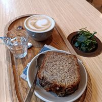 Vegan banana bread and oatmeal cappuccino at Newtree Café in Lyon