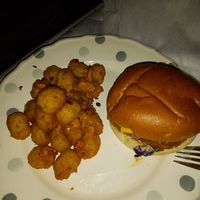 Vegan "Chicken" Burger with potato Tots with Burger Sauce & faken bacon bits, delivered via Delivaroo. at Fat Hippo in Newcastle Upon Tyne