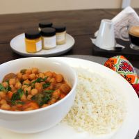 Vegan chickpea curry, coffee with chestnut milk. at Kru Cozinha Saudável in Maputo