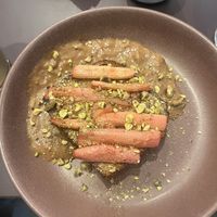 Brioche bun with rhubarb, pistacchio and earl grey sauce. Very nice!   at Rabarber in Utrecht