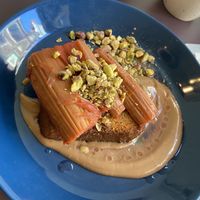 Roasted rhubarb on brioche with terragon/orange creme and pistachio: decent, but more bitter and sour than their previous brioche dishes.  at Rabarber in Utrecht