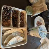 Kids meal (comes with chips and a drink) got the sofritas, black beans, pinto beans, and a side of guac (for a charge).   at Chipotle in Lake Grove