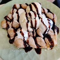 Waffle with ice cream, whipped cream and chocolate sauce at Cafe Nisse in Imatra
