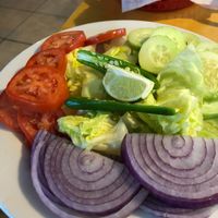Indian salad (sliced tomatoes, cucumbers, onions, hot peppers with lemon)  at Taste of India in Reno