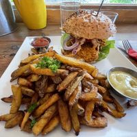 Crunchy Tempeh burger with fries  at Neue Republik Reger in Berlin