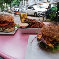 Crispy tempeh burger, fries and cheezy burger at Neue Republik Reger in Berlin