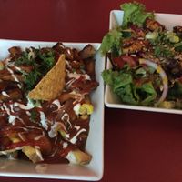 Poutine and salad with extra tempeh  at Neue Republik Reger in Berlin