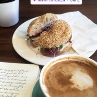 Bagel sandwich and flat white  at Away Kitchen + Cafe - Queen St in Toronto