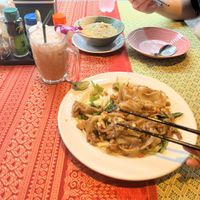 Top: massaman, bottom: pad see ew, drink: thai milk ice tea  at May Kaidee in Bangkok
