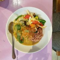 Green curry with rice and peanut sauce at May Kaidee in Bangkok