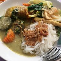 Green curry, rice noodles with peanut sauce at May Kaidee in Bangkok