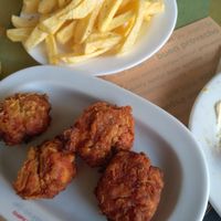 Tomato patties and fries at To Mikraki in Syros