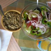 Traditional creamy parsley salad and Greek salad without the feta cheese. at To Mikraki in Syros