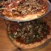 The vegan flatbread is the one on the bottom! at Flatbread Pizza in Paia