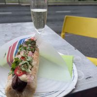 Still the same - colourful neighborhood bar with nice vegan options. And kitchen is open quite late. - This is vegan hot dog in the photo    at Bar Favela in Helsinki