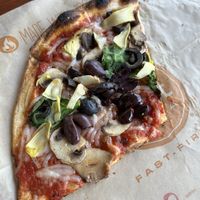 Build your own half pizza (1 piece eaten pre-photo)  at Blaze Pizza in Lake Buena Vista