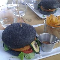 Vegan burger with fries, and spicy mango sauce at Ajo' Drink & Food in Domaso