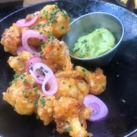 Spicy cauliflower popcorn with guac - sweet and quite spicy!  at Bighorn Bistro & Bakery in Chamonix-mont-blanc