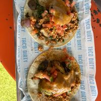 Two corn tacos with tofu “chorizo”, vegan cauliflower queso, and some veggies at Taco Dirty in Tampa