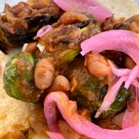 Brussel sprout taco with pinto beans and pickled onion! at Taco Dirty in Tampa