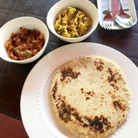 Coconut rotty with onion chutney and dry dahl at Sri Dhara Restaurant  in Unawatuna