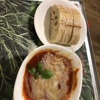 Vegetarian tomato soup with bread  at Vapiano - Walfischgasse in Vienna