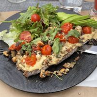 Tartine de pain complet avec houmous, avocat, salade et dukkah   at Quarts Coffee Kitchen in Agen