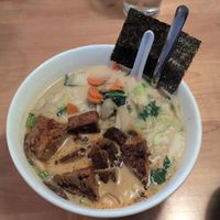 Udon noodle bowl with coconut curry broth and house made seitan at Yum Yum Noodle Bar in Red Hook
