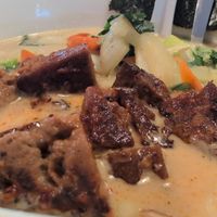 Udon noodle bowl with coconut curry broth and house made seitan at Yum Yum Noodle Bar in Red Hook