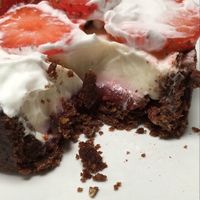 Strawberry tartelette with cacao shortbread, strawberry sauce, coconut ganache, fresh strawberries and coconut chantilly at brEAThe Restaurant - Pigalle in Paris