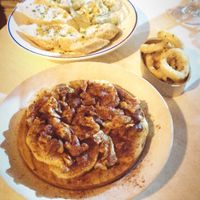 Shiitake octopus on potatoes, deep fried squid, hummus at Sa Capca in Blanes